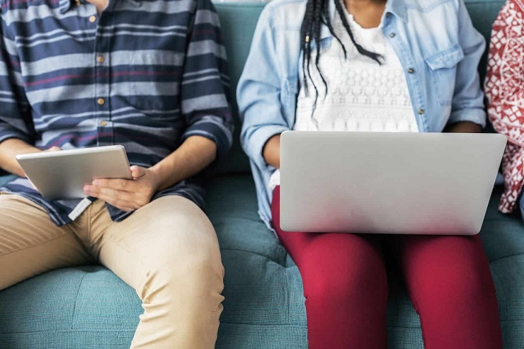 Video Content- Boy and Girl using gadgets on Couch
